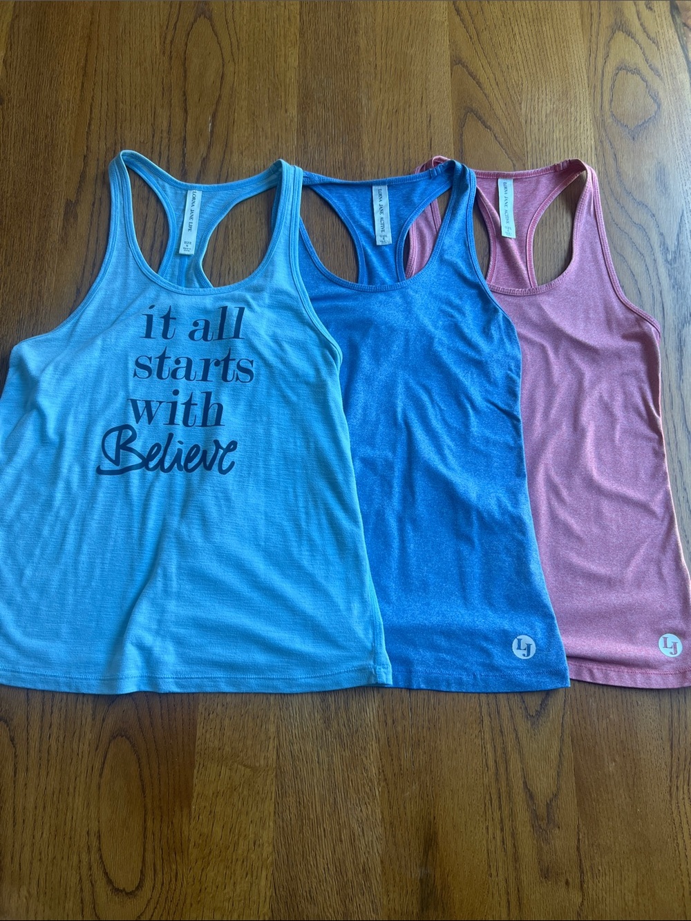 Lorna Jane Racerback Muscle Tank Trio - Light Blue, Blue, Pink